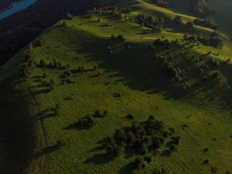 Aerial drone shot of beauty dawn on the peak, in the mountains in Altay, summertime
