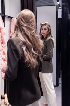 Woman in dressing room fits new formal look. Candid photo