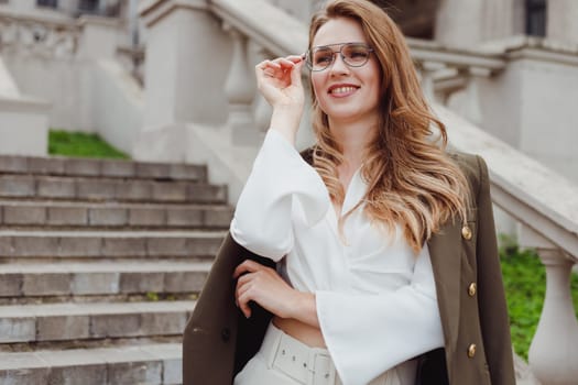 Myopia, smiling young business woman in new eyeglasses for good vision outdoors