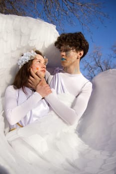 Fine art imagery. Woman and angel man embracing