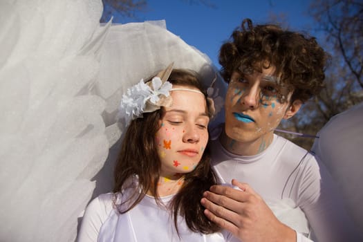 Fine art imagery. Woman and angel man embracing