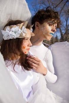 Fine art imagery. Woman and angel man embracing