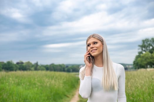 happy young woman with smartphone