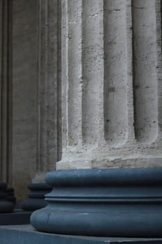 Corinthian columns on a bronze base close-up
