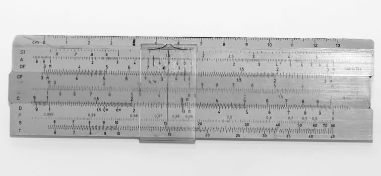 Picture of an old slide rule from the time of the GDR which the students used to expect. Antique calculator.