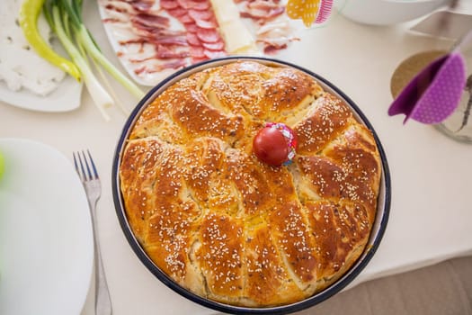 Traditional handmade holiday bread, food serving on table,  Eastern orthodox Easter day at home.