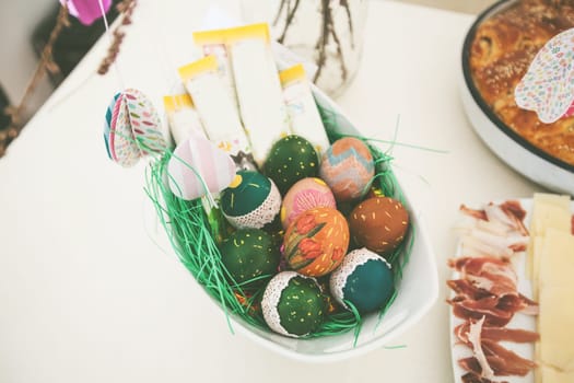 Easter eggs , traditional colorful eggs, Symbol of Eastern Orthodox Easter Day, table setting at home