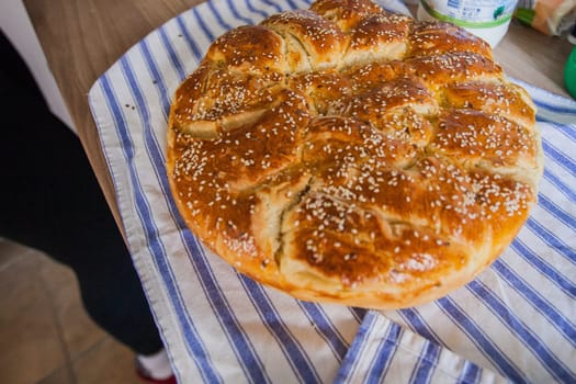 Traditional handmade holiday bread, food serving on table,  Eastern orthodox Easter day at home.