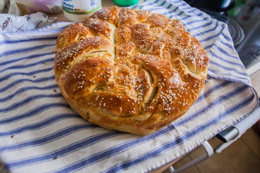 Traditional handmade holiday bread, food serving on table,  Eastern orthodox Easter day at home.