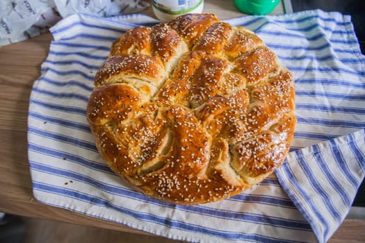 Traditional handmade holiday bread, food serving on table,  Eastern orthodox Easter day at home.