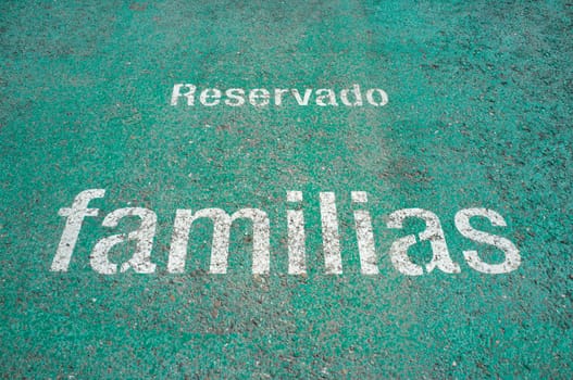 Floor signal that indicate priority parking for families. Selective focus