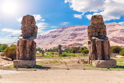 The Colossi of Memnon, famous statues of the Pharaoh Amenhotep, Luxor, Egypt.