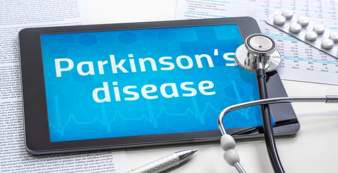 The word Parkinson's disease on the display of a tablet