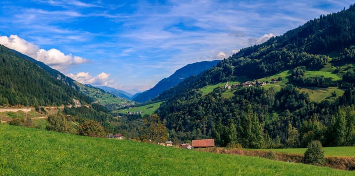 Panoramic view of a valley in the Swiss Alps in summer
