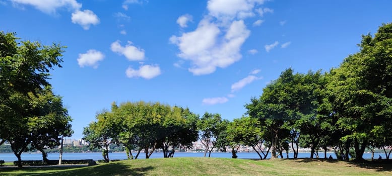 Tamsui, NEW TAIPEI CITY, TAIWAN - Sep 8, 2021 - City Tamsui Bali District in Taipei, Taiwan reflecting in the Tamsui River at nice day