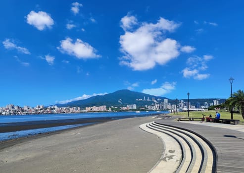 Tamsui, NEW TAIPEI CITY, TAIWAN - Sep 8, 2021 - City Tamsui Bali District in Taipei, Taiwan reflecting in the Tamsui River at nice day