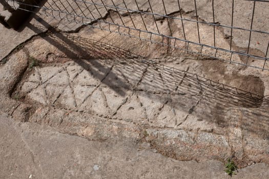 Anthropomorphic tomb on floor close to church. Acebo, beautiful little town in Sierra de Gata, Caceres, Extremadura, Spain