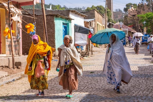 AXUM, ETHIOPIA, APRIL 27th.2019: Elder tigray women return from the morning Mass at the church of Our Lady of Zion on April 27, 2019 in Aksum, Ethiopia Africa