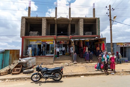 AXUM, ETHIOPIA, APRIL 27th.2019: Tigray native people in traditional market with clothes in center of Aksum on April 27, 2019 in Aksum, Tigray, Ethiopia Africa
