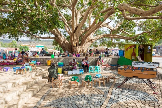 AXUM, ETHIOPIA, APRIL 27th.2019: Tigray native people resting in street market in center of Aksum on April 27, 2019 in Aksum, Tigray, Ethiopia Africa