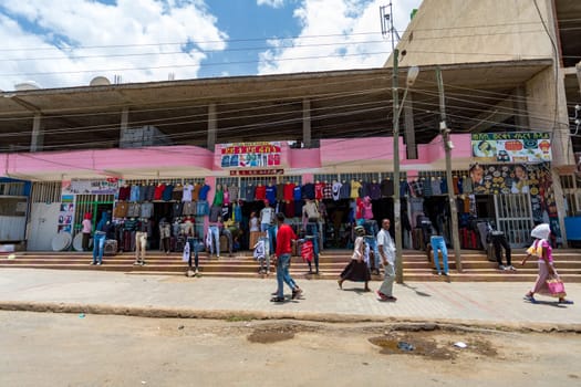 AXUM, ETHIOPIA, APRIL 27th.2019: Tigray native people in market with clothes in center of Aksum on April 27, 2019 in Aksum, Tigray, Ethiopia Africa