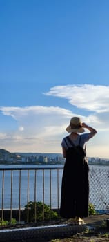 Tamsui, NEW TAIPEI CITY, TAIWAN - Sep 8, 2021 - City Tamsui Bali District in Taipei, Taiwan reflecting in the Tamsui River at nice day
