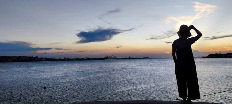 Tamsui, NEW TAIPEI CITY, TAIWAN - Sep 8, 2021 - City Tamsui Bali District in Taipei, Taiwan reflecting in the Tamsui River at nice day