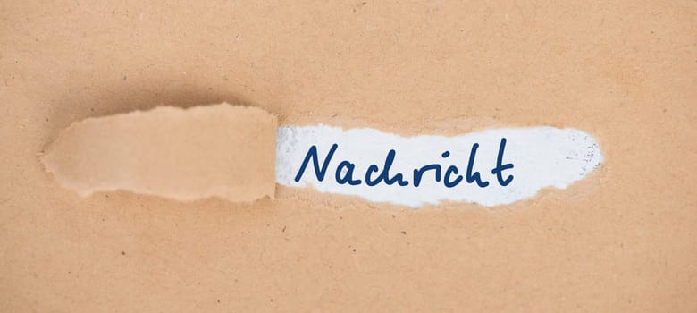 The german word message is stand on an old textured paper