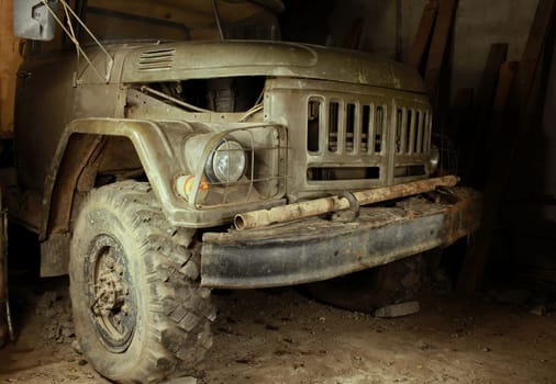 old army green truck close up at night