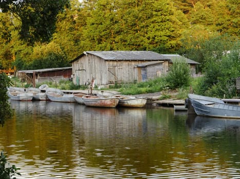 fishing boats old barn rural landscape river foreground