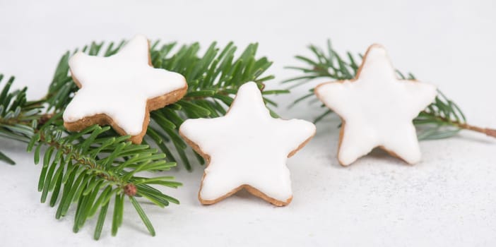 Cinnamon stars, traditional german christmas cookies, gingerbread, empty copy space, fir branch