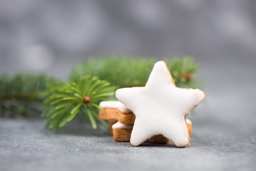 Cinnamon stars, traditional german christmas cookies, gingerbread, empty copy space, fir branch