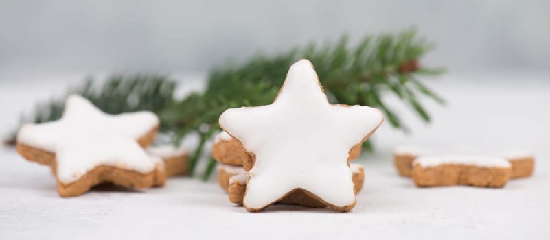 Cinnamon stars, traditional german christmas cookies, gingerbread, empty copy space, fir branch