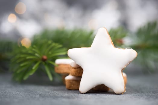 Cinnamon stars, traditional german christmas cookies, gingerbread, empty copy space, fir branch