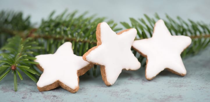 Cinnamon stars, traditional german christmas cookies, gingerbread, empty copy space, fir branch