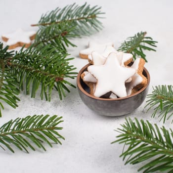 Cinnamon stars, traditional german christmas cookies, gingerbread, empty copy space, fir branch