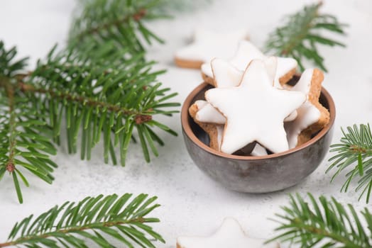 Cinnamon stars, traditional german christmas cookies, gingerbread, empty copy space, fir branch