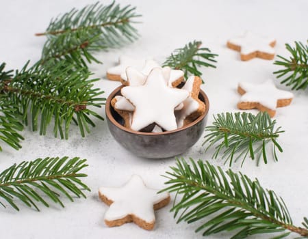 Cinnamon stars, traditional german christmas cookies, gingerbread, empty copy space, fir branch
