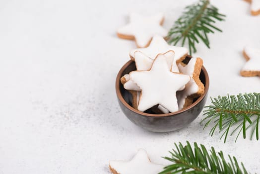 Cinnamon stars, traditional german christmas cookies, gingerbread, empty copy space, fir branch