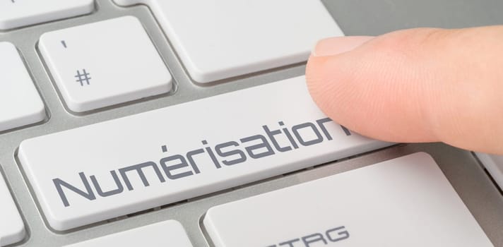A keyboard with a labeled button - Digitalization in french - Numérisation