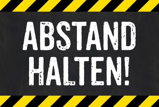 Sign with caution stripes - Keep distance in german - Abstand halten