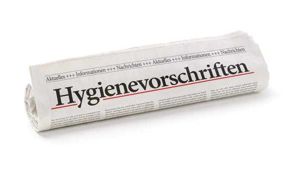 Rolled newspaper with the headline Hygiene regulations in german - Hygienevorschriften