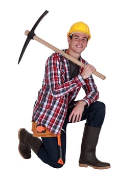 Young worker with a pickaxe