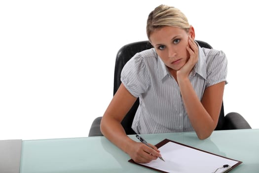 Bored woman taking notes