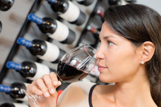 Brunette smelling wine