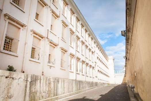 Row of windows with bars in old prison.
