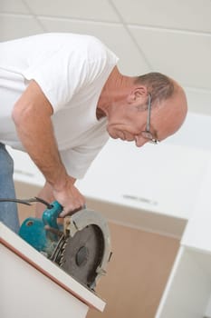 Carpenter using a circular saw
