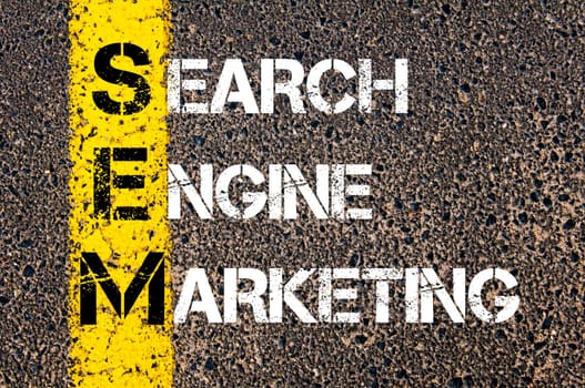 Acronym SEM - Search Engine Marketing. Business Conceptual image with yellow paint line on the road over asphalt stone background.