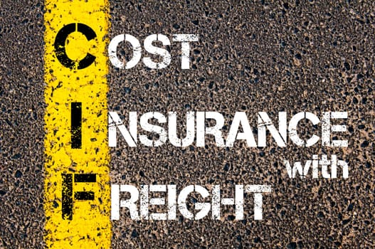 Business Acronym CIF  Cost Insurance With Freight. Yellow paint line on the road against asphalt background. Conceptual image