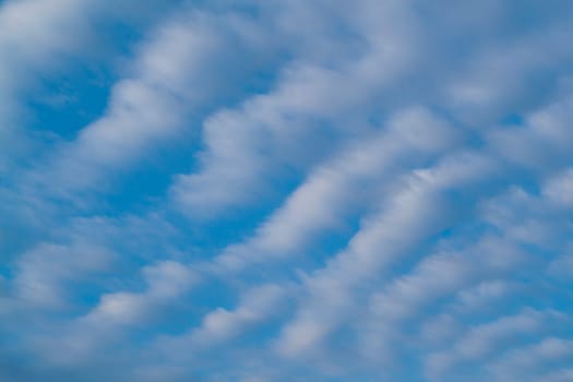 Beautiful wavy clouds with blue sky background. Nature weather, cloud blue sky